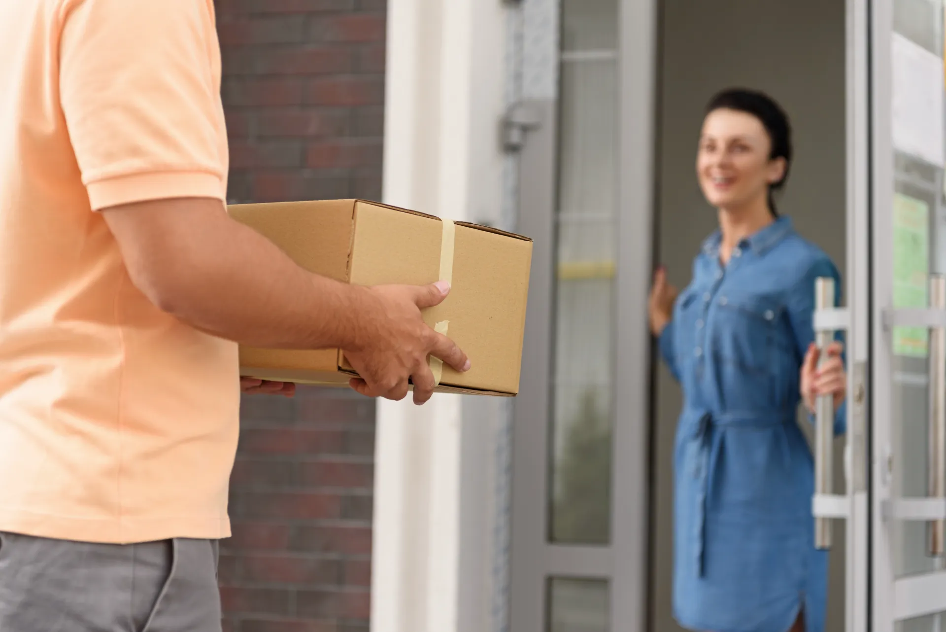 Woman receiving a discreet delivery at home