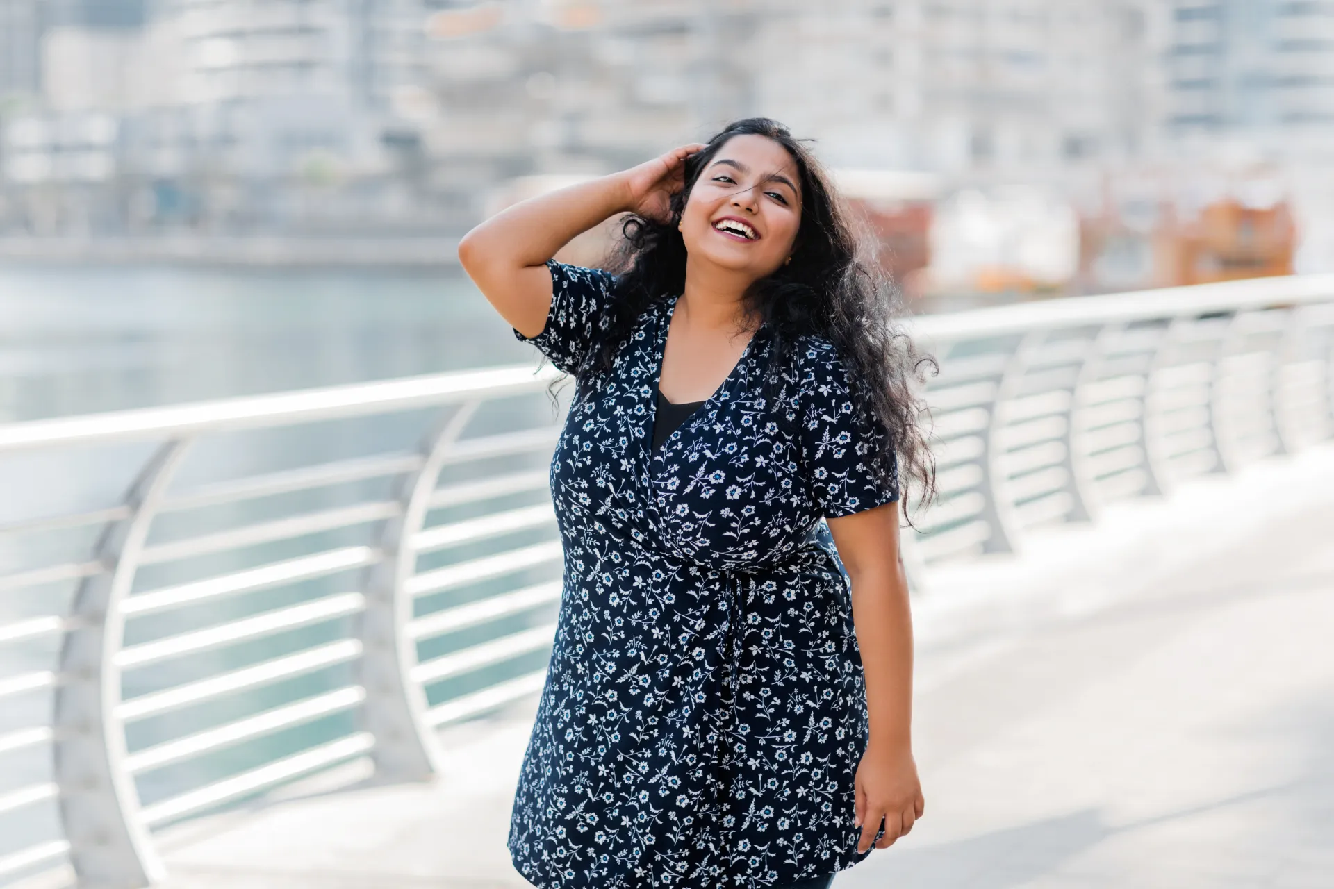 Woman smiling outdoors while receiving online healthcare support